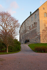 Fototapeta na wymiar A path near the wall of Turku Castle.