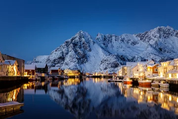 Fotobehang Nachtblauw Blue Hour and the warm lights of the houses and boats in Norway  © Amparo Garcia