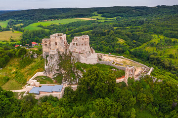 Csesznek, Hungary - Aerial drone view of the hilltop Castle of Csesznek and Csesznek city at sunset...