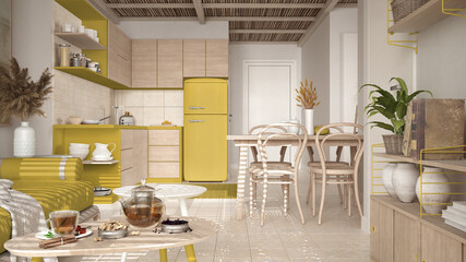 Cosy wooden sustainable kitchen and living room in yellow tones with modern sofa and coffee tables. Tea time, glass teapot and teacup, snacks. Environmental friendly interior design