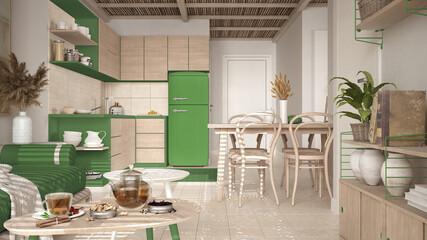 Cosy wooden sustainable kitchen and living room in green tones with modern sofa and coffee tables. Tea time, glass teapot and teacup, snacks. Environmental friendly interior design