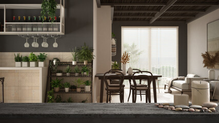 Wooden vintage table top or shelf with candles and pebbles, zen mood, over wooden living room, dining table with chairs, potted plants. Ceramic tiles, architecture interior design