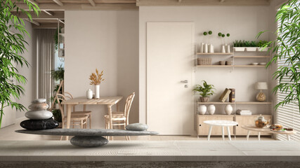 Wooden vintage table or shelf with gray pebble balance and bamboo green plants over cosy...