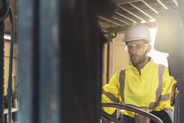 Technician/Worker operation forklift in metal hardware factory
