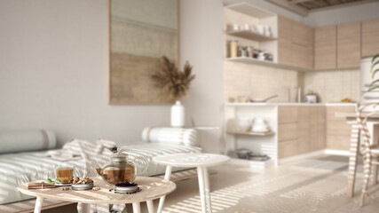 Interior design depth of field, cosy wooden sustainable kitchen and living room with sofa and coffee tables. Environmental friendly interior design, modern architecture concept idea