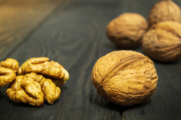 Walnuts on a vintage table. Peeled walnut kernel closeup