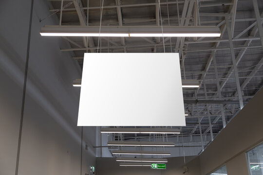 Blank White Supermarket Banners Hanging From Ceiling. Hangers Mockup Ready For Branding Or Advertising