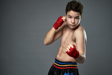 Teenage kickboxer training