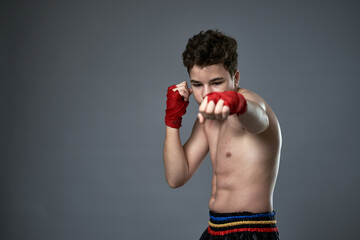 Teenage kickboxer training