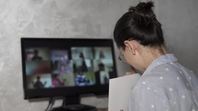Distance learning for schoolchildren. A modern teacher conducts online math lessons for schoolchildren, uses a home computer during quarantine.