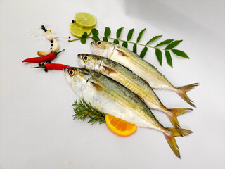 Close Up View Of Indian Mackerel Fish Decorated With Herbs. Isolated On White Background