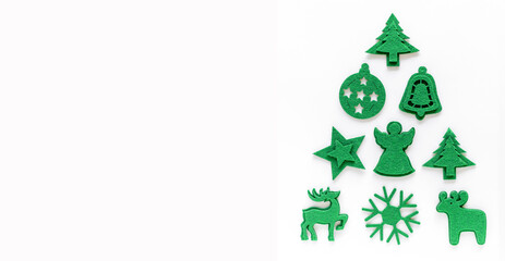 Creative christmas tree layout made from felt decorations. Flat lay, top view, copy space. Holiday festive minimal concept