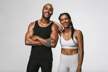 Fotobehang Portrait of smiling fitness couple © Jacob Lund
