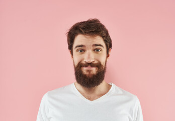 Fototapeta premium Man with beard and mustache white t-shirt pink background