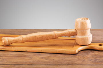 beautiful wooden kitchen hammer on a wooden stand
