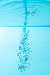 Naklejka na ściany i meble bubbles under water on blue background