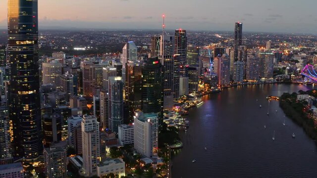 Brisbane Central Business District At Night With Brisbane River In Queensland, Australia. - aerial drone shot