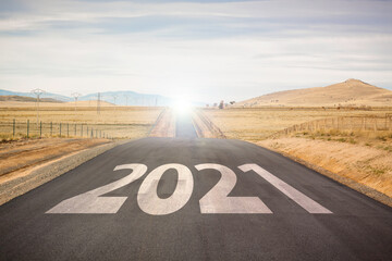Start a new year. Leave behind 2020. Lifestyle photography, woman with dog on the road in search of adventure