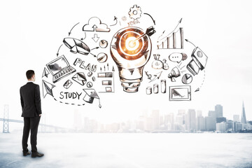 Businessman looking on drawing business sketch