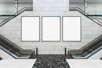 Modern shopping center with escalator and three blank posters