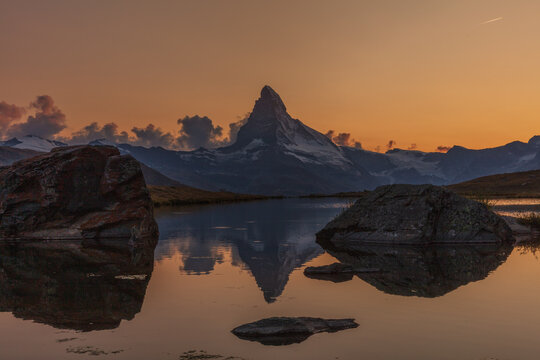 Matterhorn sunset with reflection in lake Stellisee, near Fluhalp and Zermatt, Wallis, Switzerland