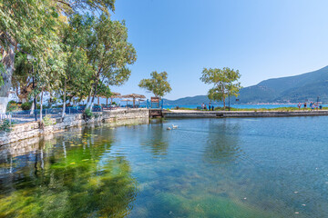 Fototapeta na wymiar View of Karavomilos natura lake with calm waters in Kefalonia Greece