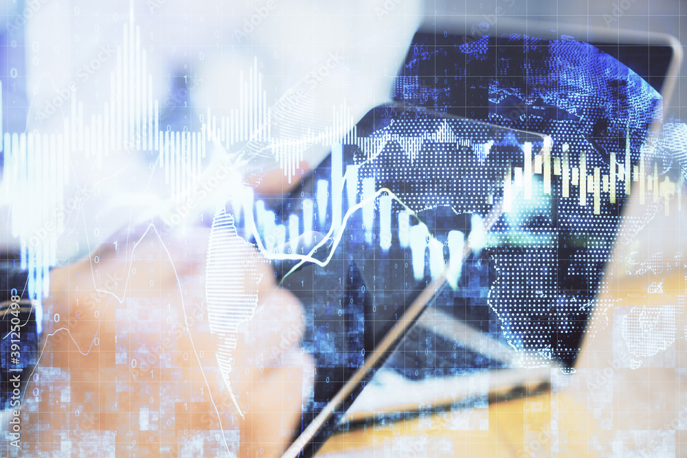Aufkleber Hand using tablet computer with business charts.