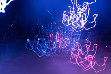 Abstract colorful light trails in the dark, motion blur effect