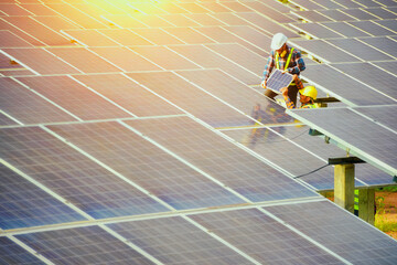 Group of engineers meeting on building roof.solar engineer and electrician with face mask checking and resolve problem of generate power in solar power plant.