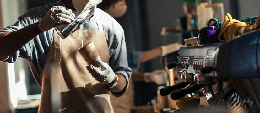 Professional barista makes cappuccino during social distance - Powered by Adobe