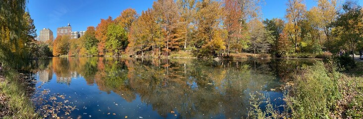 Autumn colors reflecting on the pond at the Central Park in New York City