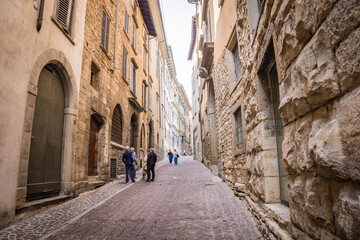 Fototapeta na wymiar BERGAMO, ITALY - SEPTEMBER 8, 2019: Streets of Citta Alta, upper old city Bergamo, Italy