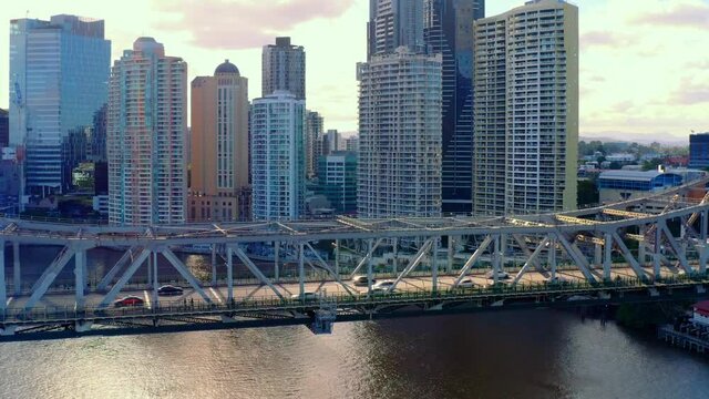 Cars Driving At Story Bridge With Brisbane Central Business District In Background In Brisbane, QLD, Australia. - aerial drone shot
