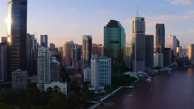 Cityscape Of Brisbane Near Brisbane River At Sunset In Queensland, Australia. - aerial drone shot