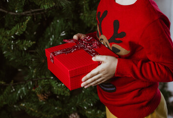 Child holding christmas gift