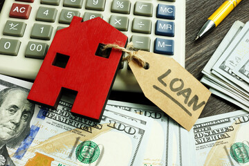 Money, home and label loan as symbol of mortgage.