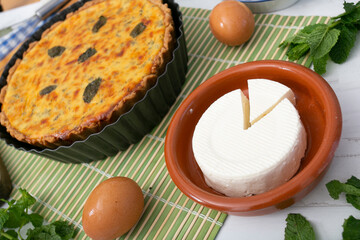 Flaó traditional dessert from Ibiza. The cheesecake is a unique combination of flavors — anise and mint.  The filling is made from fresh cheese (or ricotta and mascarpone), eggs and chopped mint.