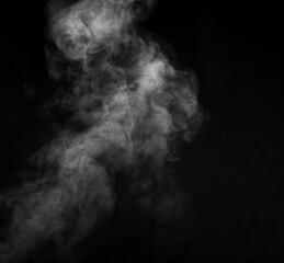Smoke fragments on a black background. Abstract background, design element, for overlay on pictures