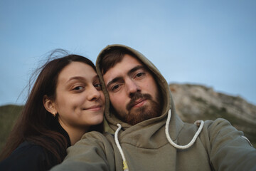 Happy couple tourists in love take selfie picture