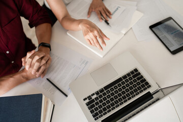 Young woman and man studying for a test or exam Tutor books with friends catching up and learning, education and school concept.