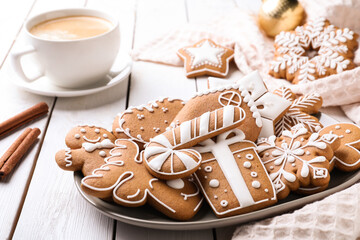 Delicious Christmas cookies on white wooden table