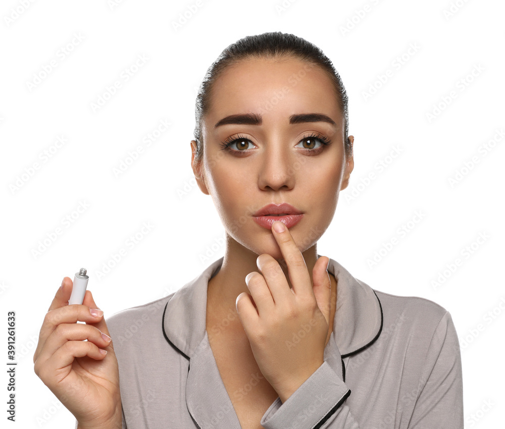 Canvas Prints Woman with herpes applying cream on lips against white background