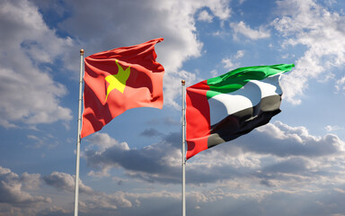 Beautiful national state flags of Vietnam and UAE United Arab Emirates together at the sky background. 3D artwork concept.