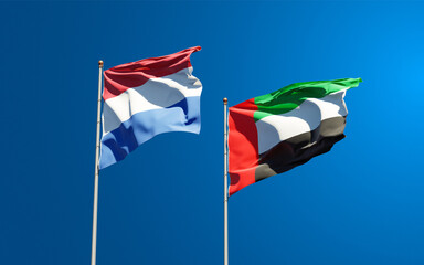 Beautiful national state flags of Netherlands and UAE United Arab Emirates together at the sky background. 3D artwork concept.