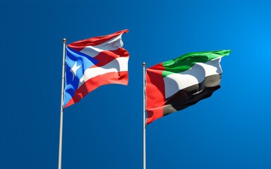 Beautiful national state flags of Puerto Rico and UAE United Arab Emirates together at the sky background. 3D artwork concept.