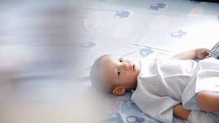 Young Boy Has a bright Face as he is resting in Quarintine in Hopsital Bed During Pandemic