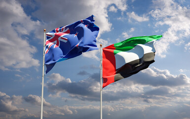 Beautiful national state flags of New Zealand and UAE United Arab Emirates together at the sky background. 3D artwork concept.
