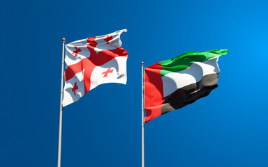 Beautiful national state flags of Georgia and UAE United Arab Emirates together at the sky background. 3D artwork concept.