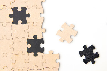 Wooden jigsaw puzzle pieces on a white background