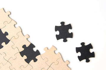 Wooden jigsaw puzzle pieces on a white background